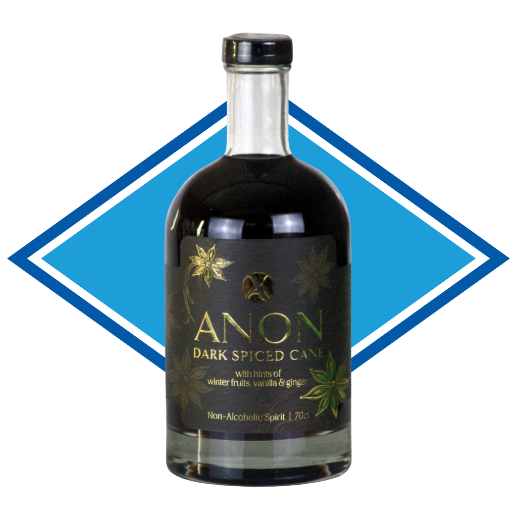 A bottle of Anon Dark Spiced Cane non-alcoholic spirit, featuring a black label with gold lettering and botanical illustrations, set against a blue and white diamond-shaped graphic background.