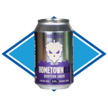 A can of Fierce Beer Hometown 0.5 Scottish Lager, featuring a metallic silver and purple label with a white skull graphic, set against a blue and white diamond-shaped background.