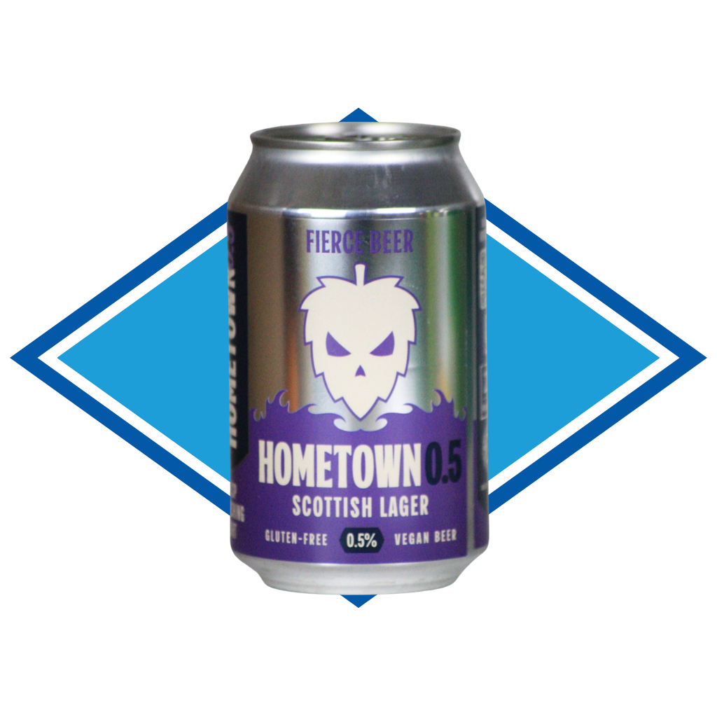 A can of Fierce Beer Hometown 0.5 Scottish Lager, featuring a metallic silver and purple label with a white skull graphic, set against a blue and white diamond-shaped background.