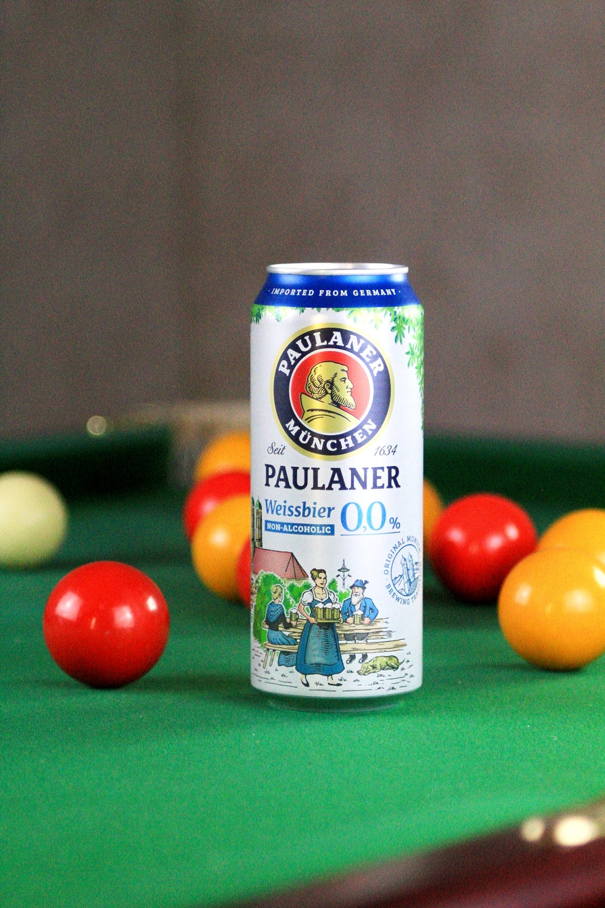 Paulaner Alcohol Free beer can on a pool table with billiard balls