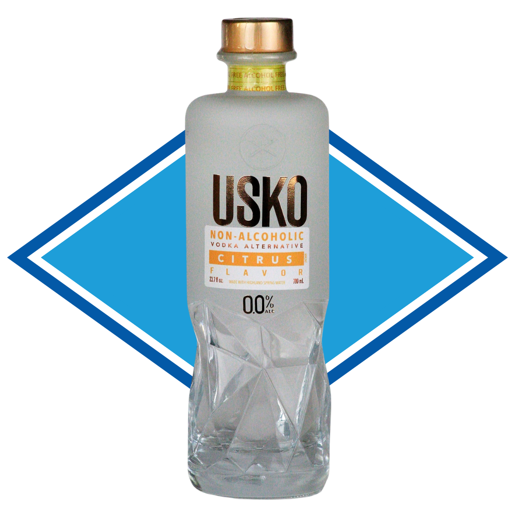 Clear bottle of USKO non-alcoholic citrus alternative with a blue diamond shape in the background