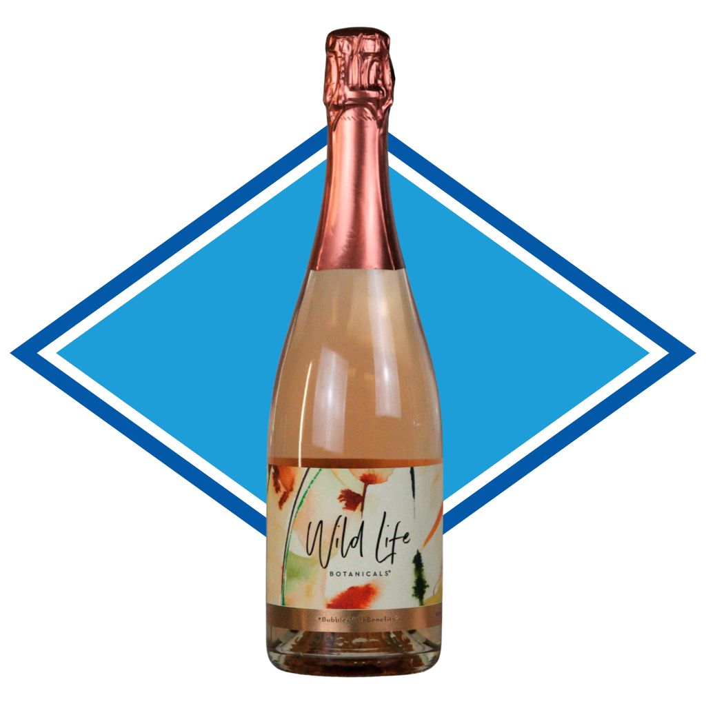 A bottle of Wild Life Botanically Rose Gold Non-Alcoholic Sparkling Wine, featuring a metallic rose gold foil neck and a white label with botanical illustrations, set against a blue and white diamond graphic on a white background.