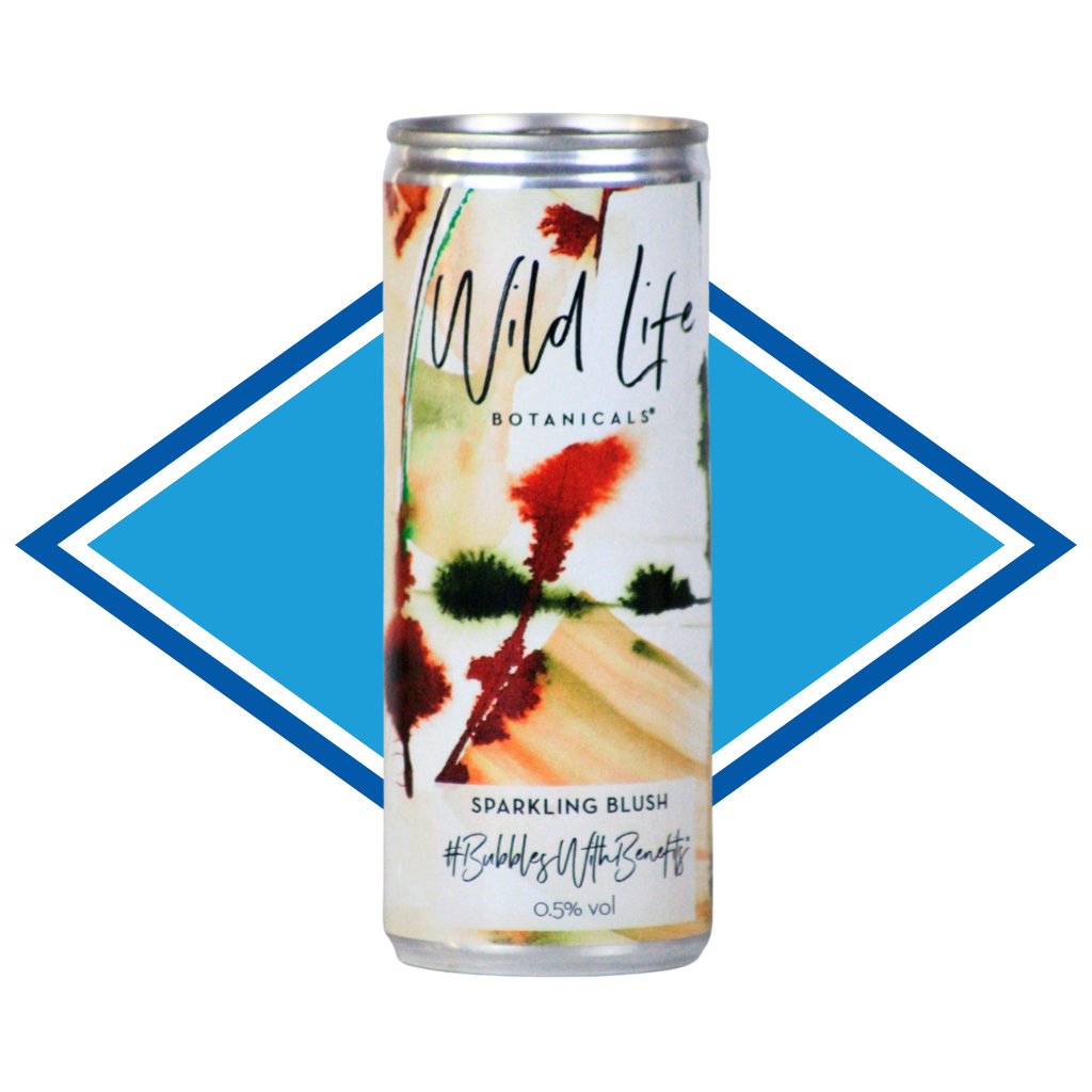 A single can of Wild Life Botanicals Sparkling Blush beverage centered on a blue and white diamond-shaped graphic background. The can features a botanical-style label with cream, red, green, and peach tones and readable text including the brand name and flavor.
